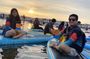 Paddle surfing experience at sunset