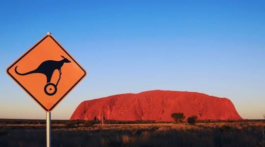 Quarter Uluru self-balancing scooter and sunset