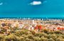 Audio-guided walking tour of Barcelona with Montjuic cable car voucher