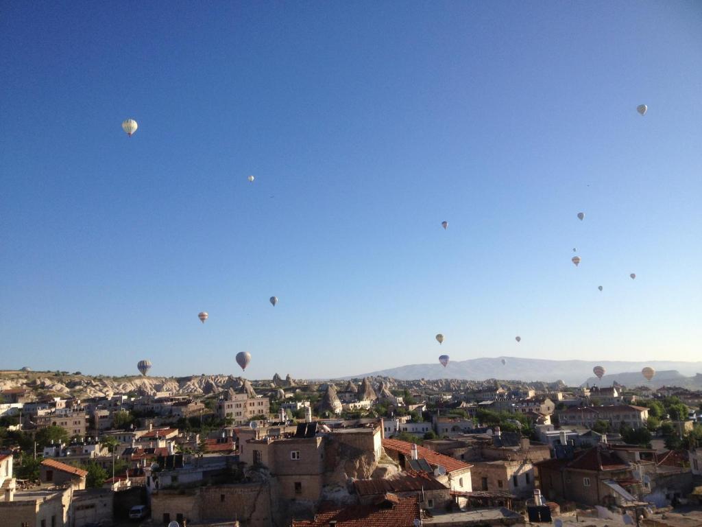 Discover the heart of Göreme at Kookaburra Pension, offering affordable comfort, local cuisine, and stunning views for an unforgettable stay.