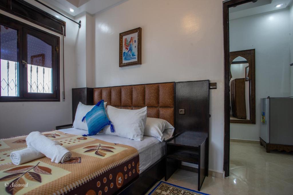 Unwind at Sunset at Sunset, a magical bar in Chefchaouen offering breathtaking views and a relaxing ambiance amidst vibrant blue-washed buildings.